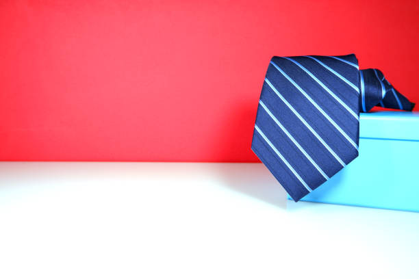 istock Striped pattern zipper necktie with gift box with color background close up view 1921103585