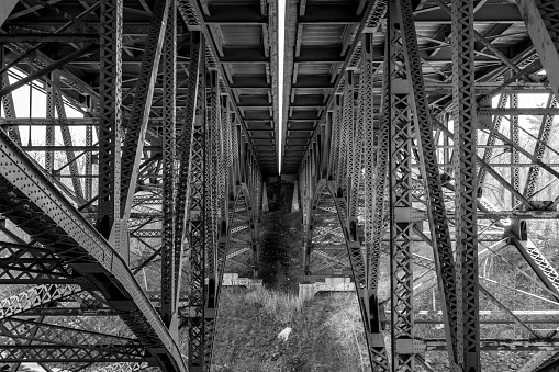 Geometric view of trestles under overpass in black and white in Albany, New York, United States