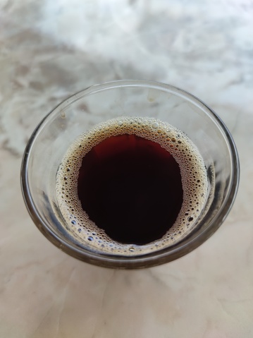 Black coffee in a small glass is a typical coffee from Aceh