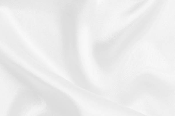 istock White fabric texture for background and design, beautiful pattern of silk or linen. 1921111127