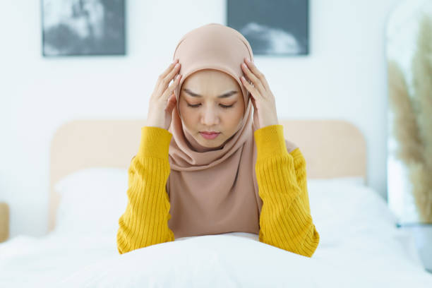 istock Headache muslim woman. 1921140396