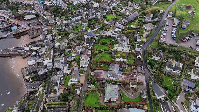 Passing above the rooftops towards the harbour and River Fowey in Polruan Cornwall