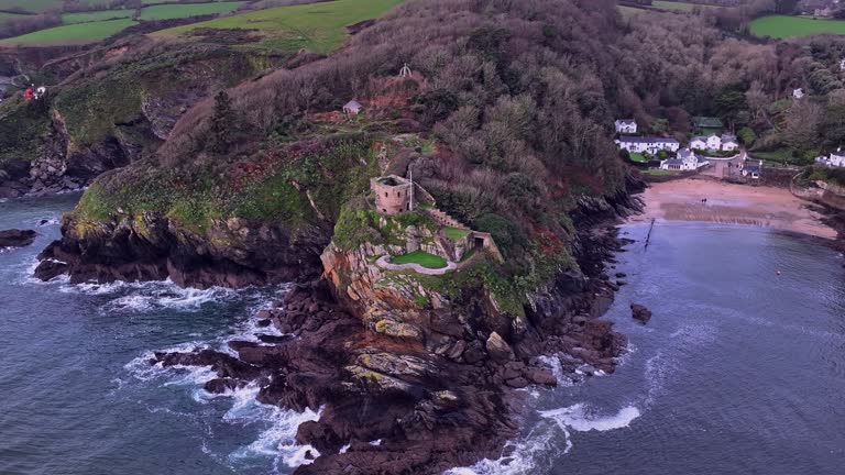 Circling the remains of St Catherine's castle on a rocky outcrop on the river Fowey