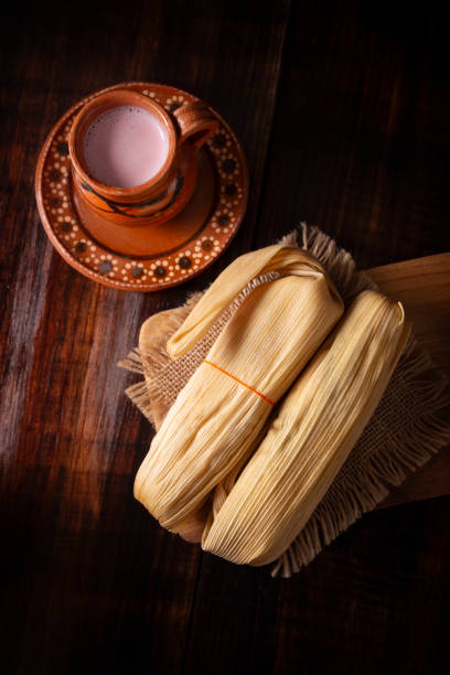 istock Atole and Tamales on dark background table topview 1921174250