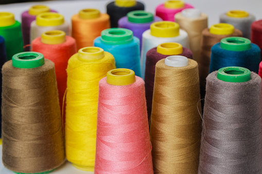 Sewing thread spools in a different colors.