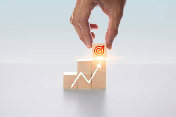 istock Target analysis Strategic planning for setting business goals for efficiency, results and success.The symbol bow on the wooden block is arranged vertically. 1921266467