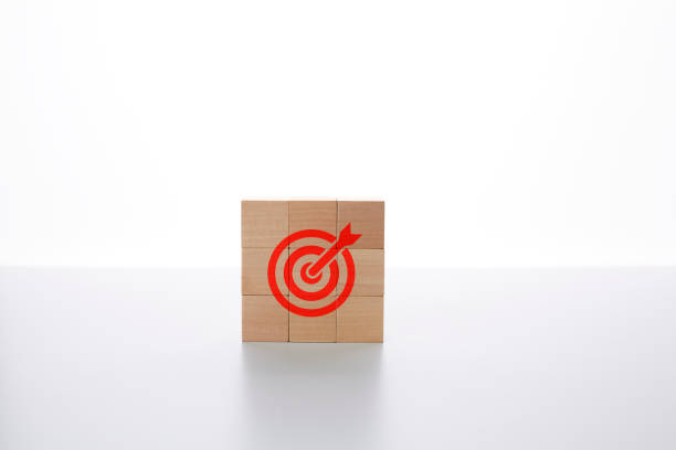 istock Target analysis Strategic planning for setting business goals for efficiency, results and success.
The symbol bow on the wooden block is arranged vertically. 1921266469