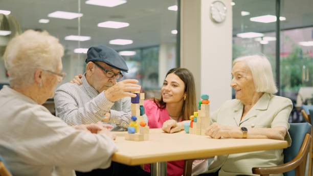 istock Tender nurse approaching to talk to senior people 1921293674