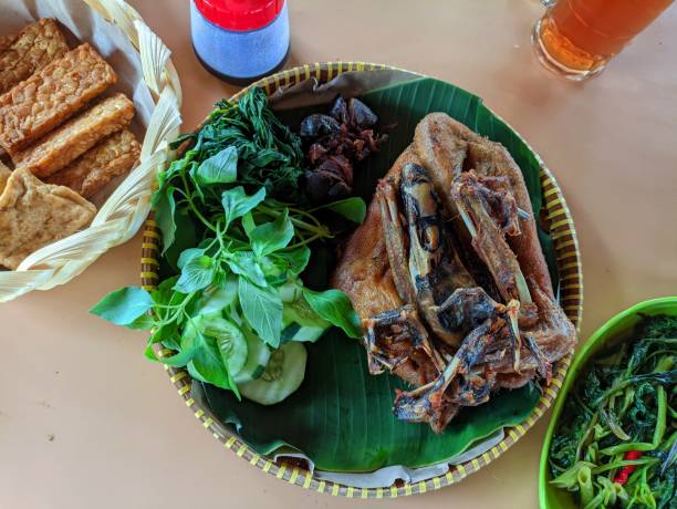 istock fried duck on banana leaves 1921362651
