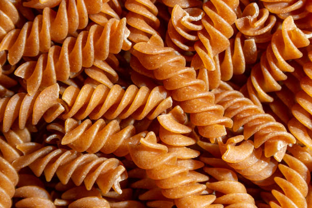 istock Uncooked Whole Grain Fusilli Pasta Background 1921371184