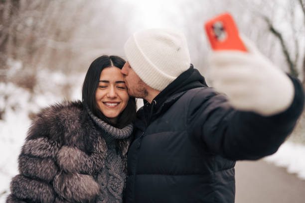 istock Young couple in the snow 1921373247