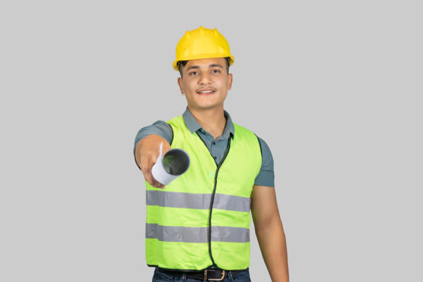 istock An Asian Happy Construction Worker Engineer giving expression gestures with chartpaper and notebook 1921387492