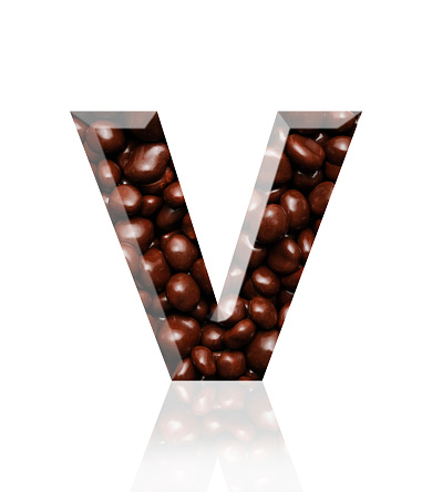 Close-up of three-dimensional chocolate alphabet letter V on white background.
