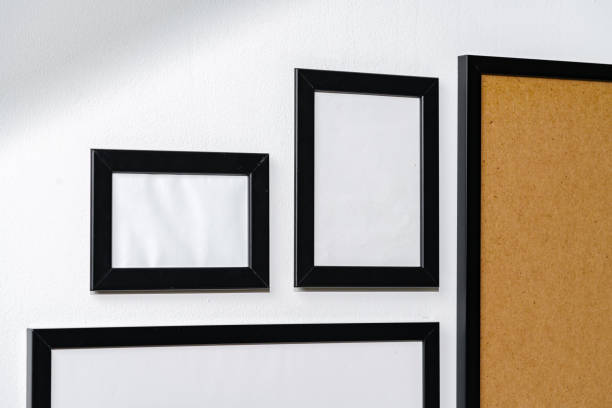 istock Set of black frames on white wall with copy space 1921422152