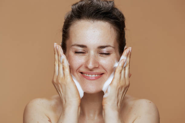 istock happy woman washing face 1921446408