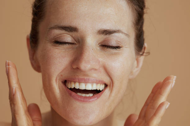 istock happy modern woman with wet face washing 1921446924