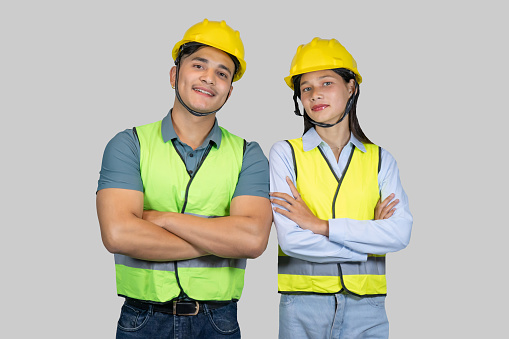 Asian Couple Engineer and Architect giving gestures and expressions on construction field