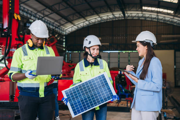 istock Engineers and foreman inspecting and meeting about the automated arms machine welding robots. Worker industry inspect and analyze solar panels. 1921466031