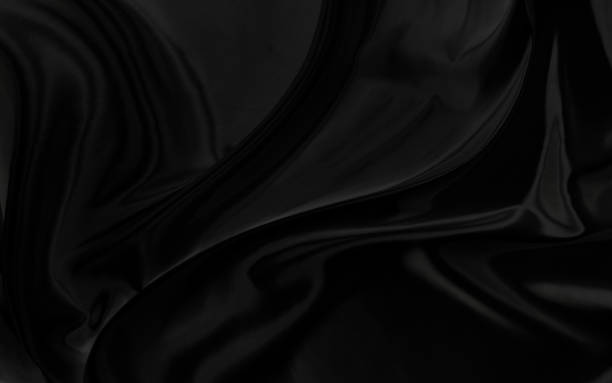 istock Black gray satin dark fabric texture luxurious shiny that is abstract silk cloth background with patterns soft waves blur beautiful. 1921485961