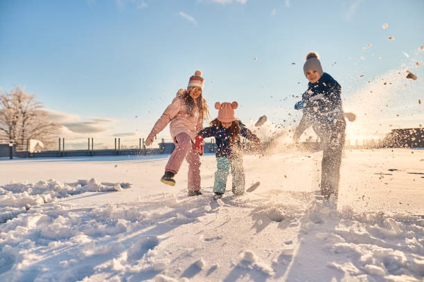 Happy kids enjoying winter snow