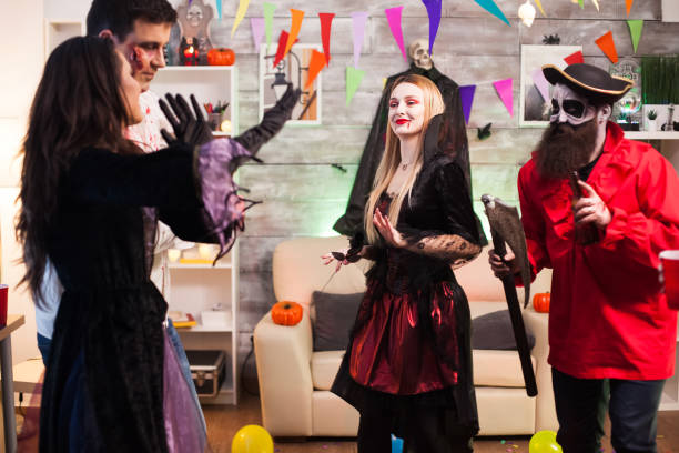 istock Cheerful woman dressed up like a vampire with bloody lips 1921521795