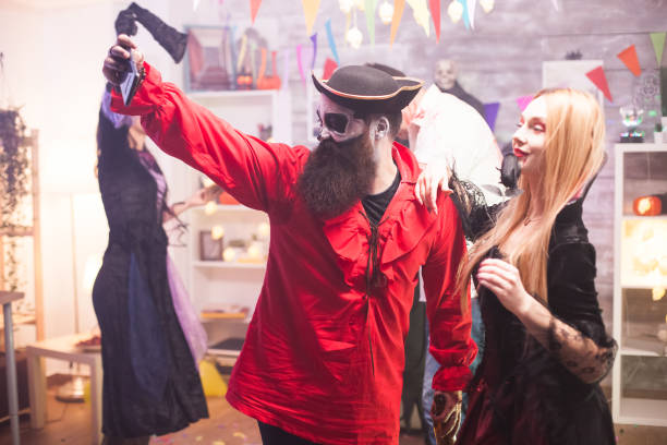istock Close friends in pirate and vampire costumes 1921522873
