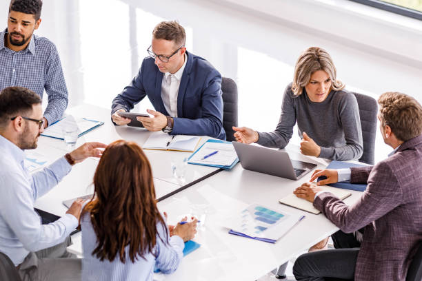 istock Business colleagues talking while working on a meeting in the office. 1921526502