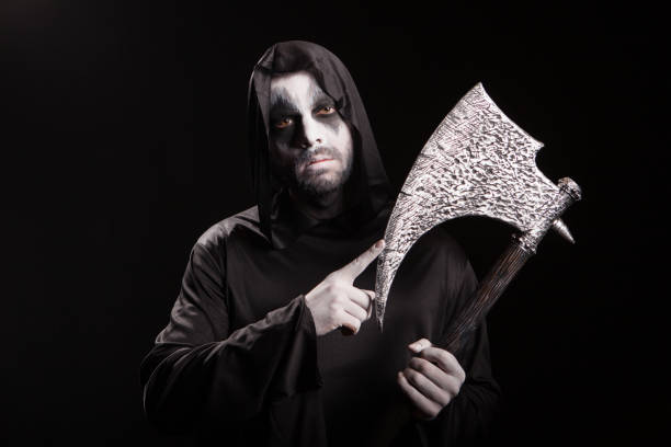 istock Dangerous scary man dressed up like grim reaper 1921529131