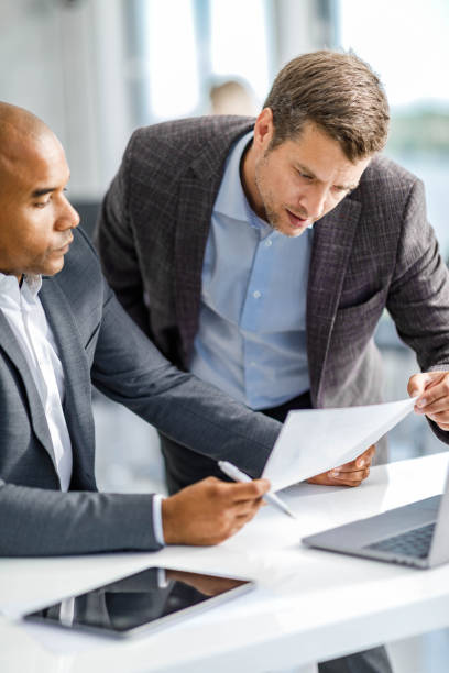 istock Male entrepreneurs analyzing reports in the office. 1921532809