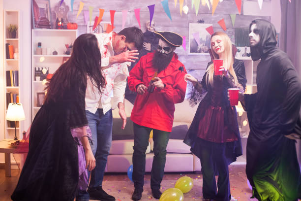 istock Group of friends celebrating halloween 1921536992