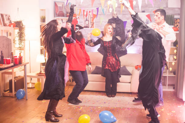 istock Group of friends dancing with hands up 1921537508