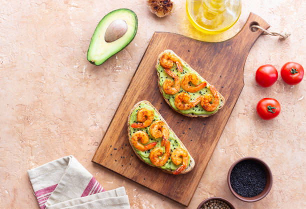 sandwiches with shrimp and guacamole. healthy eating. diet. breakfast. - sandwich avocado prepared shrimp bread stock-fotos und bilder