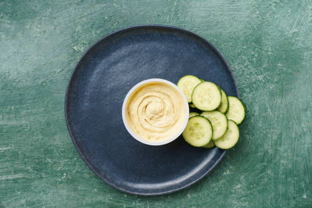 plate with bowl of sauce with vegetables