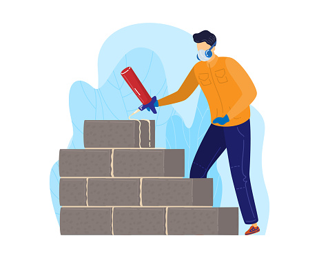 Worker in orange jacket applying cement on bricks for construction. Male builder constructs brick wall, wearing safety gloves and headphones. Construction worker on site vector illustration.