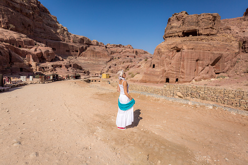 A tourist moves across the lost city of Petra