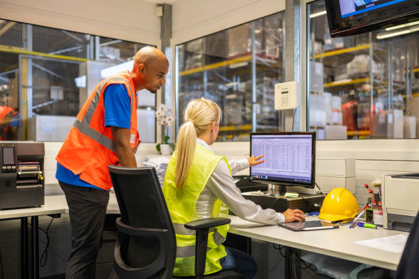 istock Shipping operator showing orders list to worker 1921632539