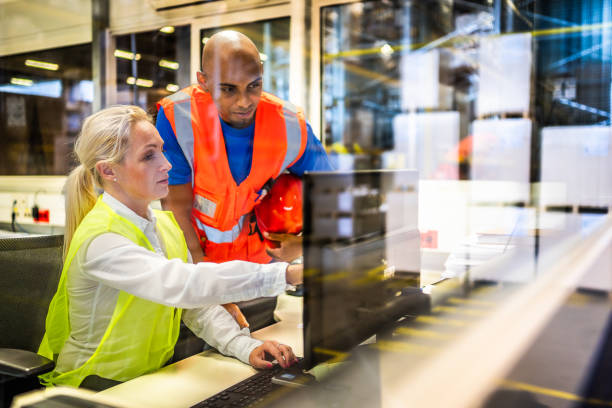 Shipping operator showing orders list to worker