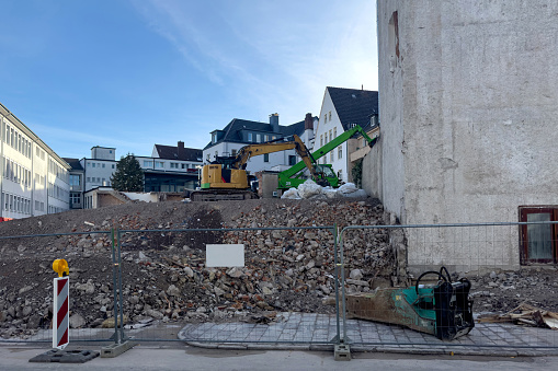 An Excavator Demolishing Houses For Reconstruction On A Construction Site