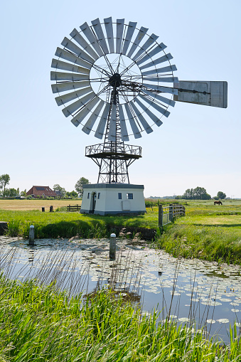 American wind engine from 1920 near Weidum in Friesland The Netherlands. Nowadays a reserve pumping station in case of serious flooding.
