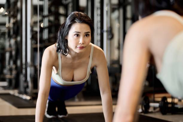 istock A woman training her upper body with push-ups 1921701108