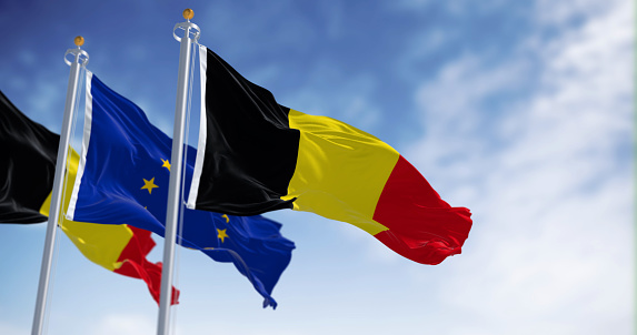Belgium national flags and European Union flags waving in the wind. 3d illustration render. Fluttering fabric. Selective focus