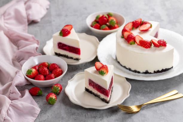 istock No bake cheesecake with fresh strawberries on top on a white plate on a gray concrete background. 1921707072