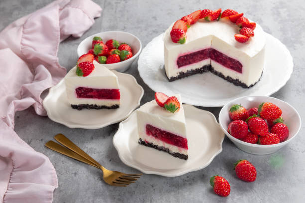 istock No bake cheesecake with fresh strawberries on top on a white plate on a gray concrete background. 1921707085