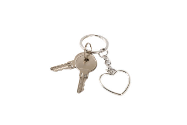 istock Keychain with key ring isolated on white background. Concepts for real estate and moving home or renting property. Buying a property. Mock-up keychain.Copy space. 1921708024