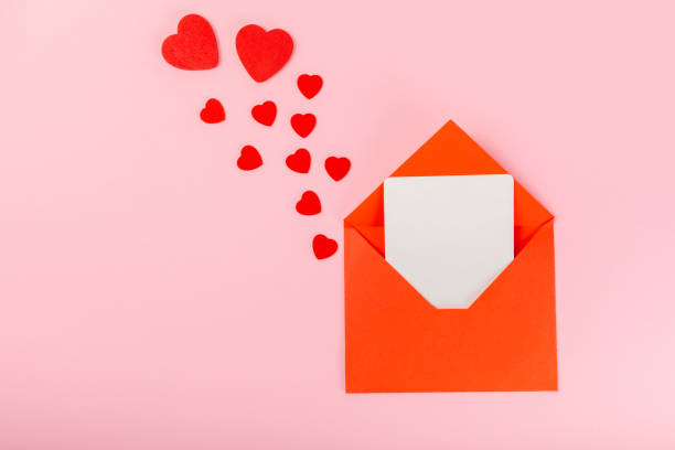 istock Valentine's Day concept. Valentine's Day background. Gifts, candles, confetti, envelope - postcard, sweets, glasses, wine and a bouquet of roses on background. Flatley, top view. 1921709800