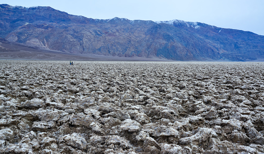 Salt with clay, Smooth salt valley with cracked and swollen salt, dead salt landscape, Death Valley National Park, California
