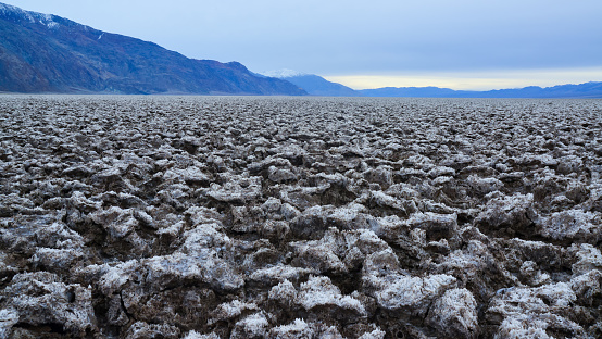 Salt with clay, Smooth salt valley with cracked and swollen salt, dead salt landscape, Death Valley National Park, California