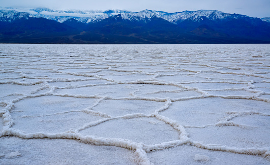 Death Valley National Park, Salt with clay, California. Smooth salt valley with cracked and swollen salt, dead salt landscape