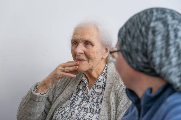 Elderly woman having a visit