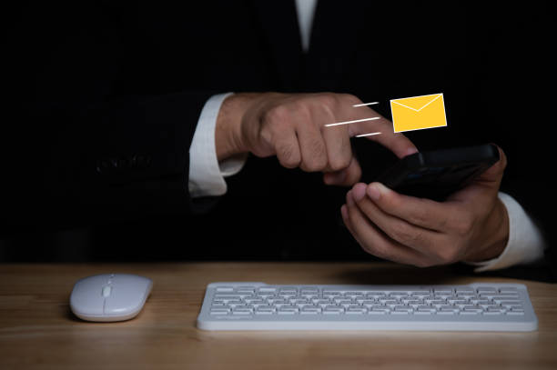 istock Businessman sending email by smartphone 1921721036
